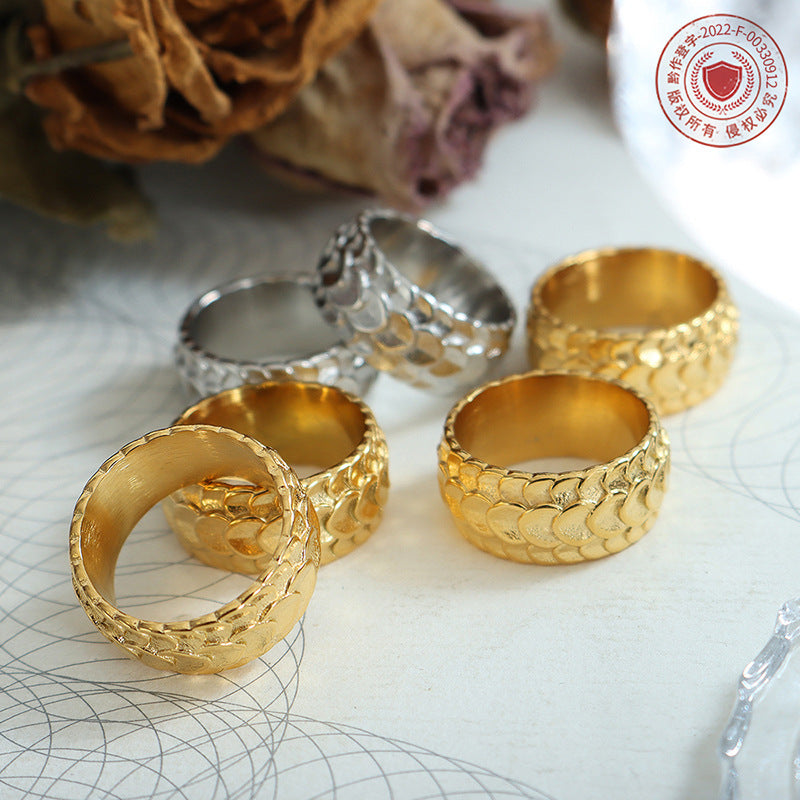 Titanium steel 18K gold plated geometric stripe ring on hand, Close-up of horizontal striped design on gold plated ring, Luxury gift box with 18K gold titanium steel jewelry, Water-resistant gold plated ring with recycled titanium steel,Two-year guarantee hypoallergenic gold tone ring