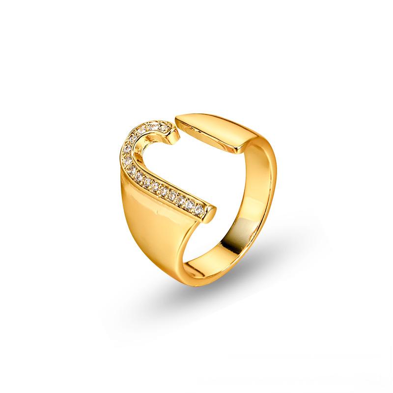 Adjustable brass letter A ring with micro-paved zirconia stones close-up, Top view of 18K gold-plated brass alphabet ring set spread on velvet, Side view of brass letter D ring worn on finger with adjustable opening, Macro shot of zirconia stone details and brass texture on alphabet ring, 