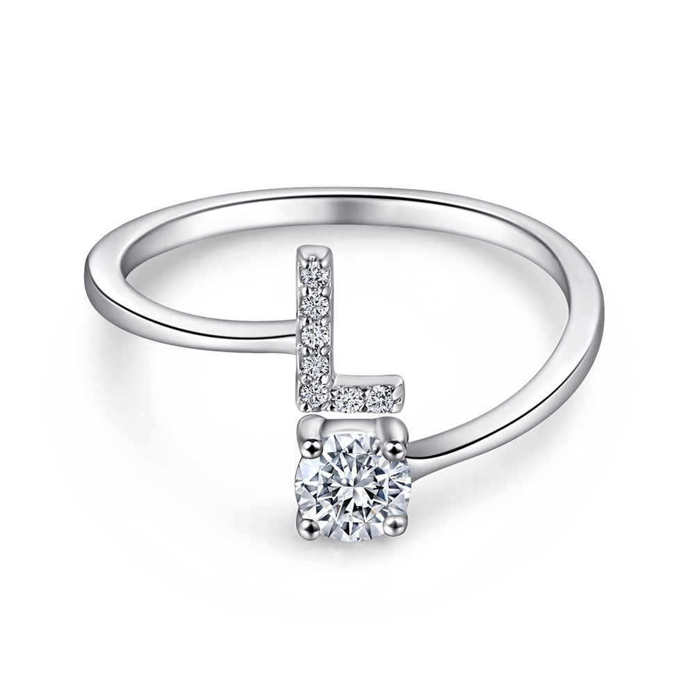 Close-up of S925 sterling silver rhodium-plated adjustable letter A ring with zirconia center stone, Top view of 26 alphabet sterling silver rings spread display with adjustable clasp detail, Side-lit shot of rhodium-plated letter S ring worn on finger with sparkling zirconia, Macro view of zirconia stone brilliance and rhodium-plated silver surface texture